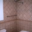Curved shower curtain rod above curved tub