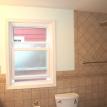 New Symington maintenance free double hung window with privacy glass.